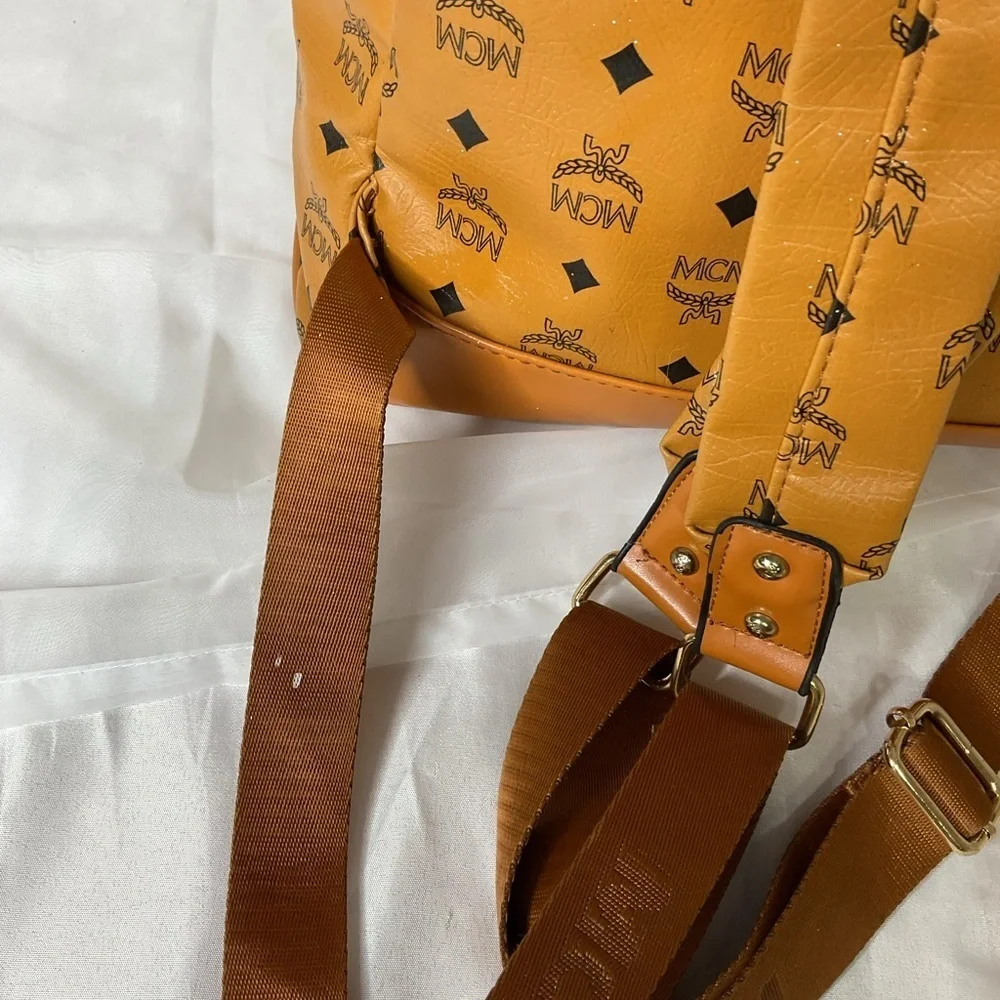 MCM Tan Backpack with Iconic Monogram Design